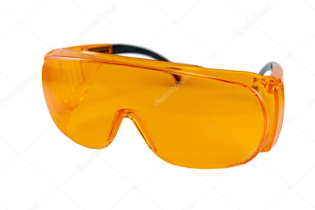 orange protective glasses in dentistry for work with UV lamp, glasses for light seals