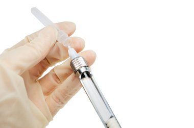 dentist's hand with carpool syringe for local anesthesia on white background isolated clipart