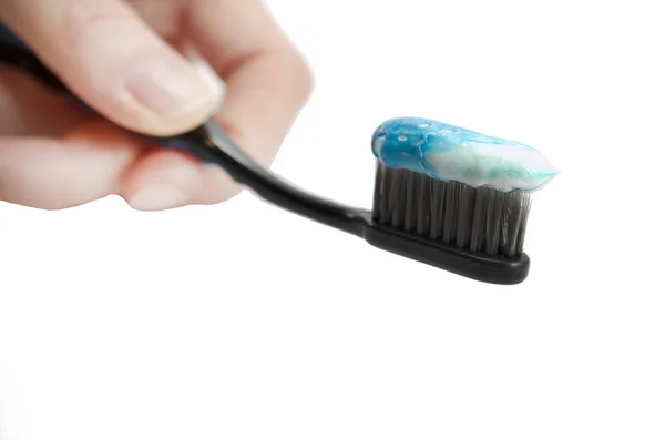 Black Toothbrush Minty Color Toothpaste Girl Hand White Background Isolated — Stock Photo, Image