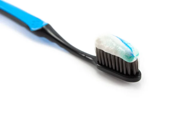 Black Toothbrush Minty Color Toothpaste Light Background — Stock Photo, Image