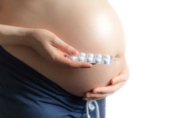 Zwanger Meisje Met Pillen Achtergrond Van Een Zwangere Buik Het — Stockfoto