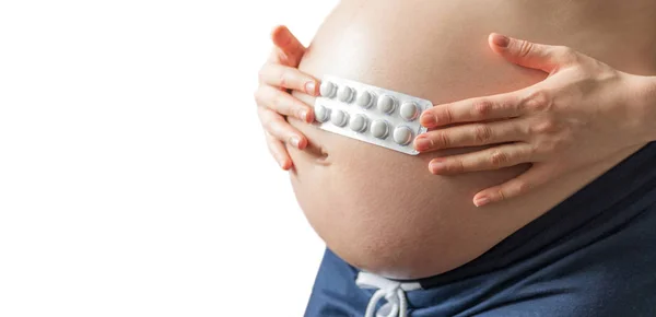 Zwanger Meisje Met Pillen Achtergrond Van Een Zwangere Buik Het — Stockfoto