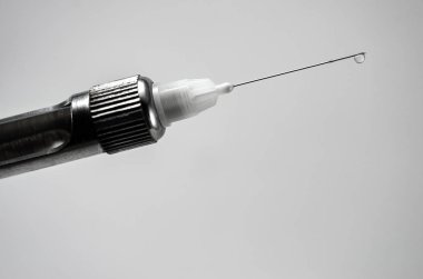 needle and carpool syringe for local anesthesia in dentistry isolated on background close-up macro