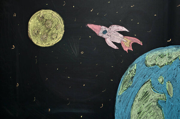 drawing chalk on the Board rocket flying from earth to the moon, the journey to the moon