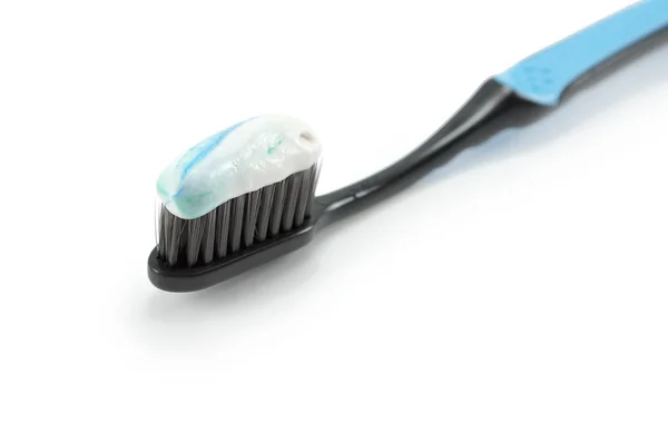 Black Toothbrush Minty Color Toothpaste Light Background — Stock Photo, Image