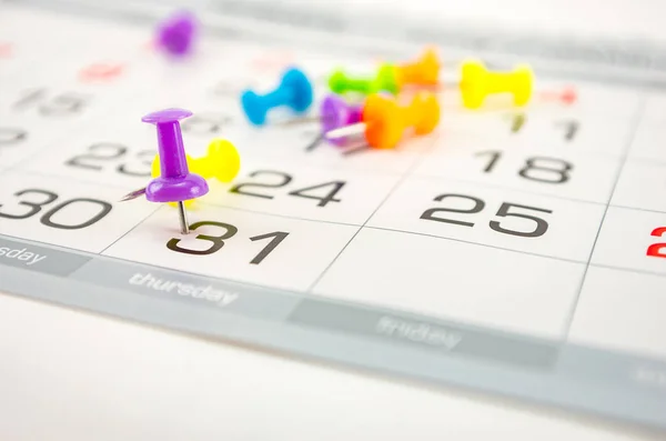 stock image pin on calendar on last date of month, end of month, reports, end of work, deadline