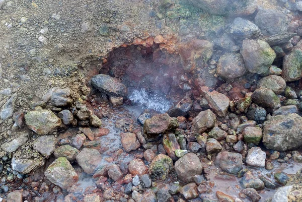boiling hot spring water, boiling water on the stones of geyser, hot spring soil