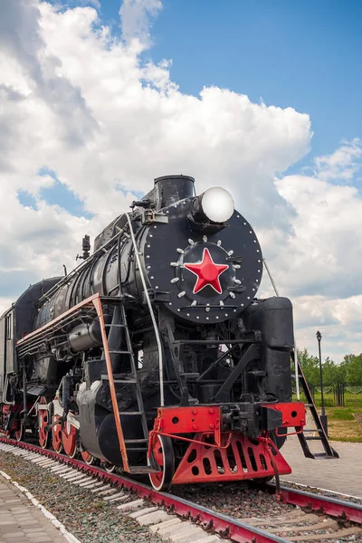 vintage steam train hurtling at speed along the rails, retro vehicle, steam engine