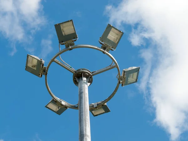 led urban lighting lamp on a pole against the blue sky, eco-friendly energy-saving technology in the urban environment