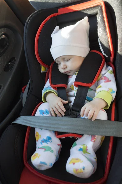 baby in the car, the concept of safe transportation of children in the car seat, seat belts, safe movement