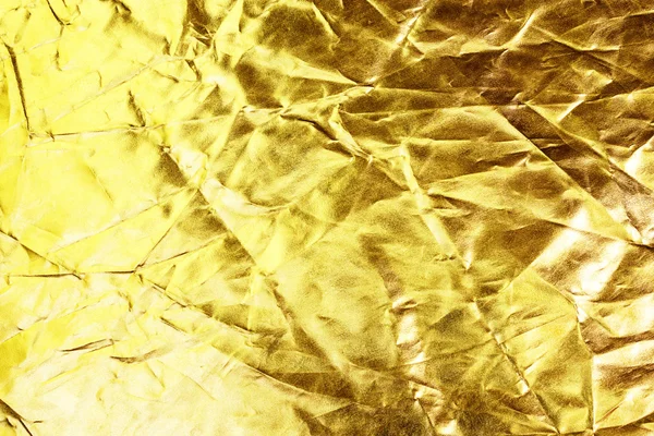 Fundo dourado ou textura e sombra. vinco de tecido de ouro — Fotografia de Stock