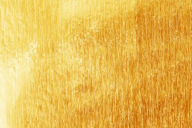 Parlak sarı altın folyo doku için arka plan ve gölge. Altın  