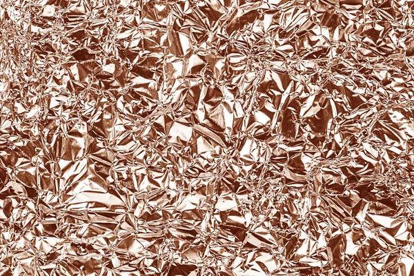 Shiny foil texture for background. Rose gold color