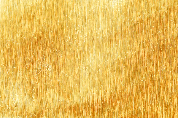 Textura de folha de ouro amarelo brilhante para fundo e sombra. Ouro — Fotografia de Stock