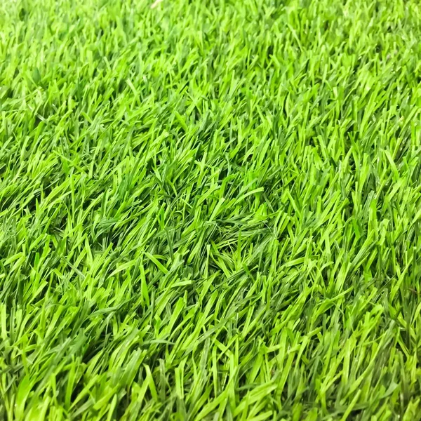 背景に人工の緑の草のテクスチャ — ストック写真