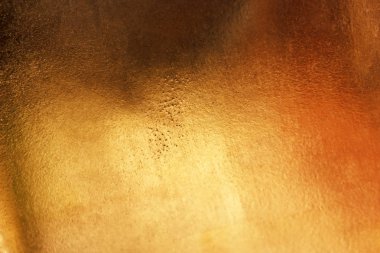 Altın soyut arkaplan veya doku ve gradyan gölgesi.