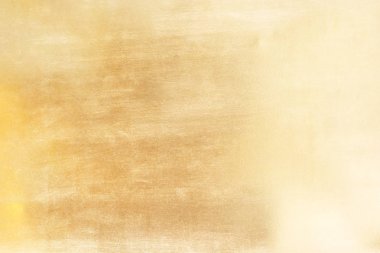 Altın soyut arkaplan veya doku ve gradyan gölgesi.