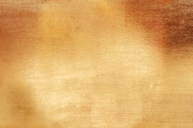 Altın soyut arkaplan veya doku ve gradyan gölgesi.