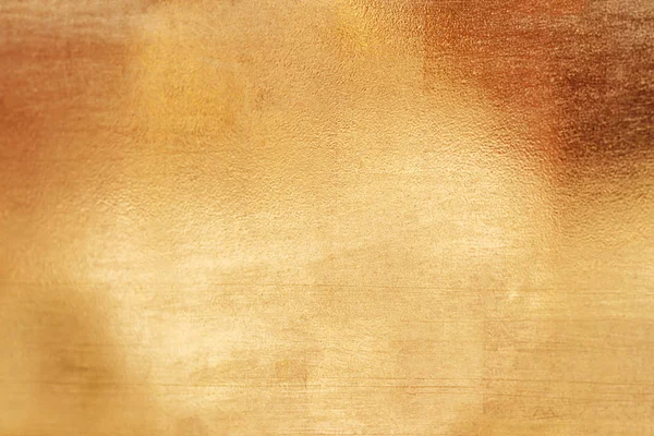 Altın soyut arkaplan veya doku ve gradyan gölgesi.