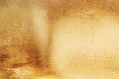 Altın soyut arkaplan veya doku ve gradyan gölgesi.