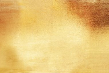 Altın soyut arkaplan veya doku ve gradyan gölgesi.