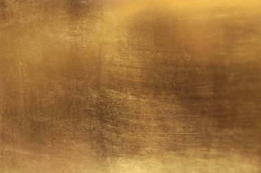 Altın soyut arkaplan veya doku ve gradyan gölgesi.