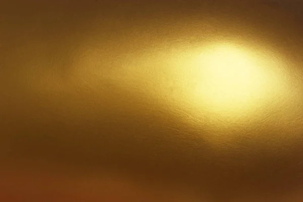 Gold abstract background or texture and gradients shadow with single point light.