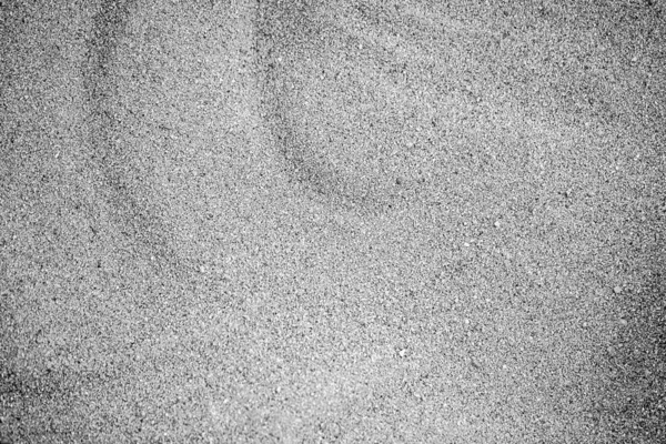 Sand textur eller bakgrund, grå färg. — Stockfoto