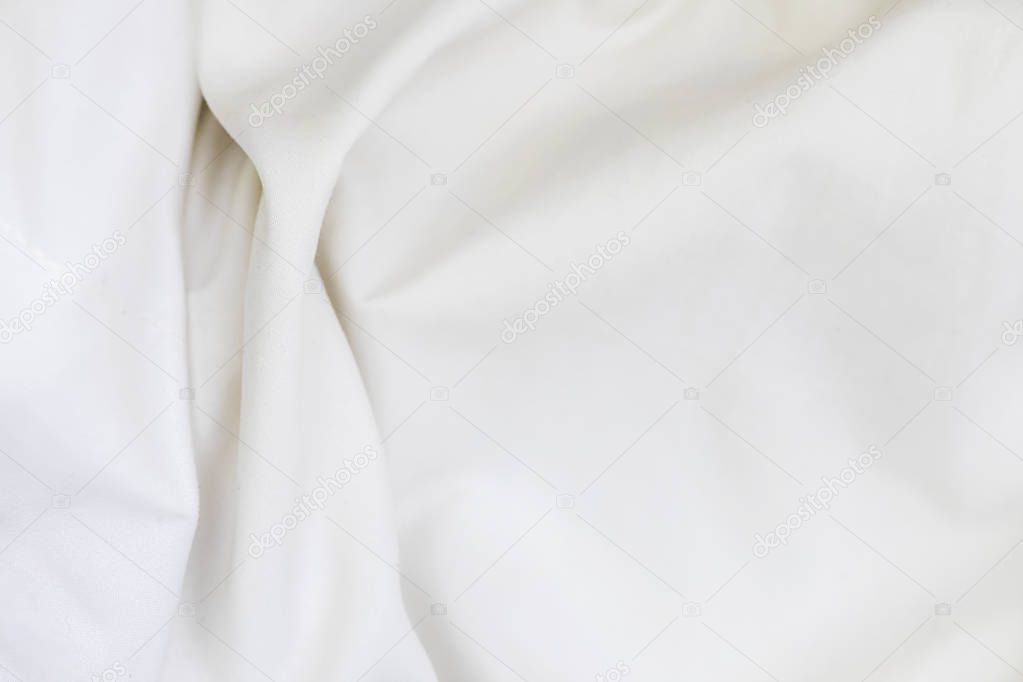 Close up of white bedding sheets soft focus and copy space.