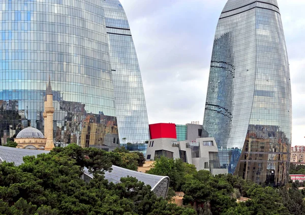 Shahids mosque in front of Flame towers in Baku Royalty Free Stock Images