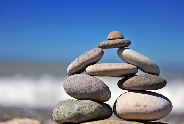 Stones pyramid standing at the sea