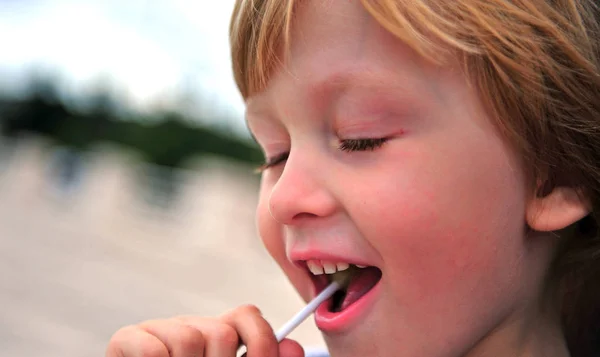 Portrait of a boy with lollipop — Stock Photo, Image