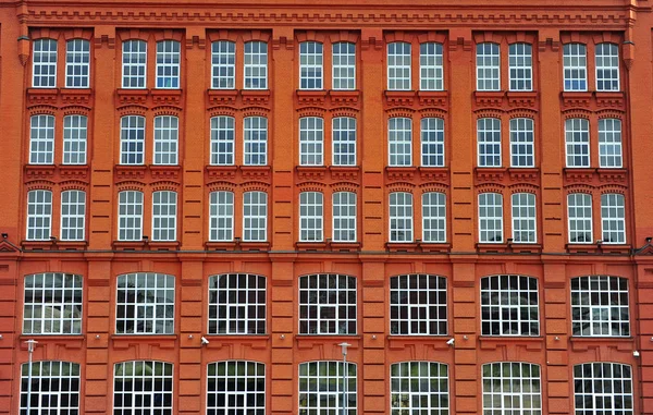 Windows of the red brick house in Moscow