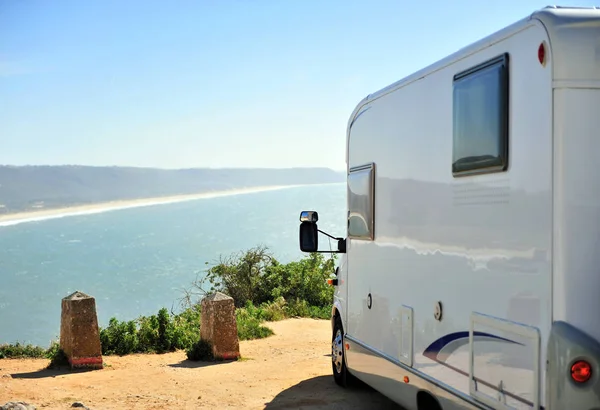Travel camper van parking over the sea