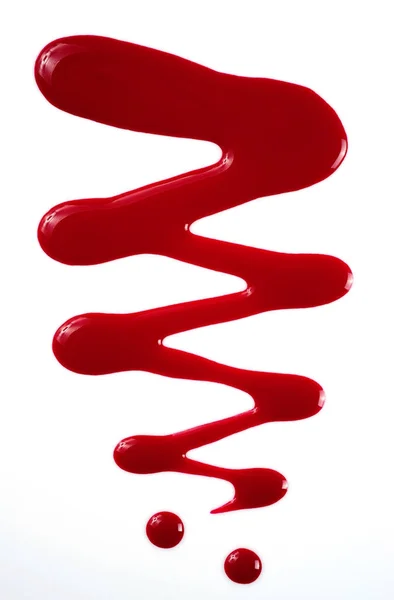 Esmalte de uñas rojo sobre blanco — Foto de Stock