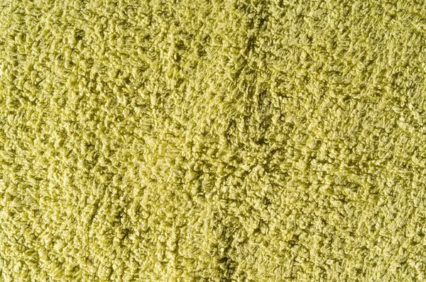 Düz yeşil havlu. Kaba kumaş dokusuna.