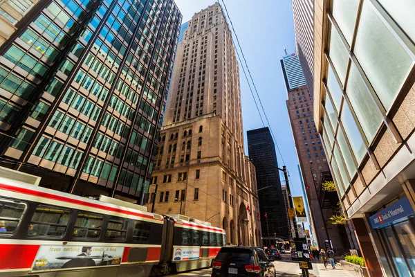 Amazing view of old and modern style buildings in down town Toronto area with cars and street car passing by — Stock Photo, Image