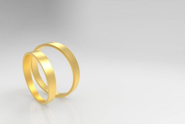 3d rendering. A couple simple Golden rings on gray background.