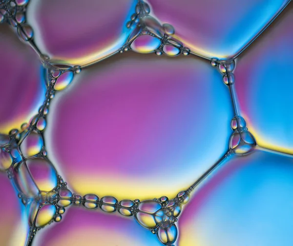 Foam multicolored bubble texture. Abstract background and texture of multicolored bubbles