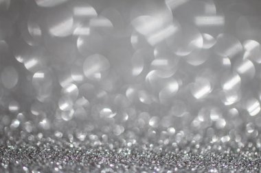 Gümüş Soyut Parıltı Parlatıcı Parıltılı Bokeh ışıkları ile Odaklanmış Arkaplan. 