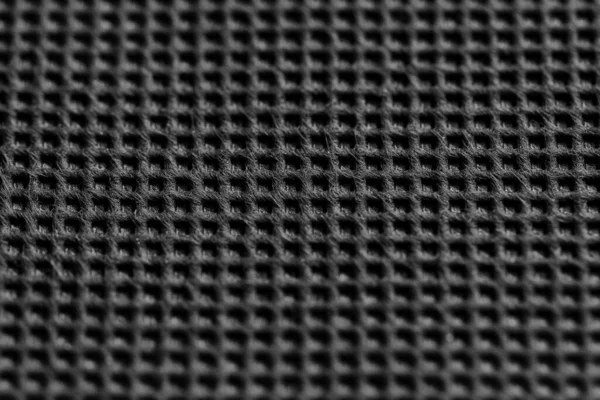 Černá symetrická textura ze syntetických vláken. Vlněná textura černé tkaniny. Zavřít. — Stock fotografie