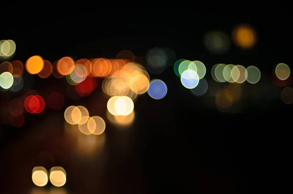 Blurred images of car lights on the road at night.