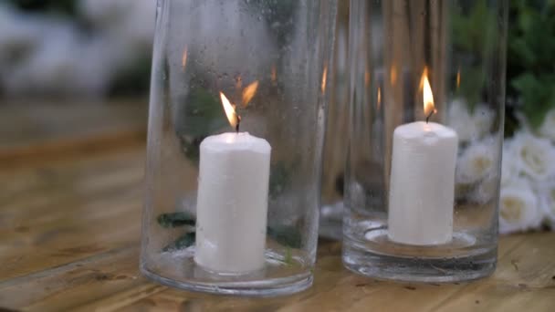 White wedding decoration candles in special glass closeup — ストック動画