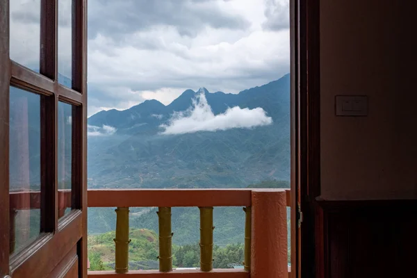 Sa Pa valley and mountain range from an hotel room doorway, Sa Pa, Vietnam