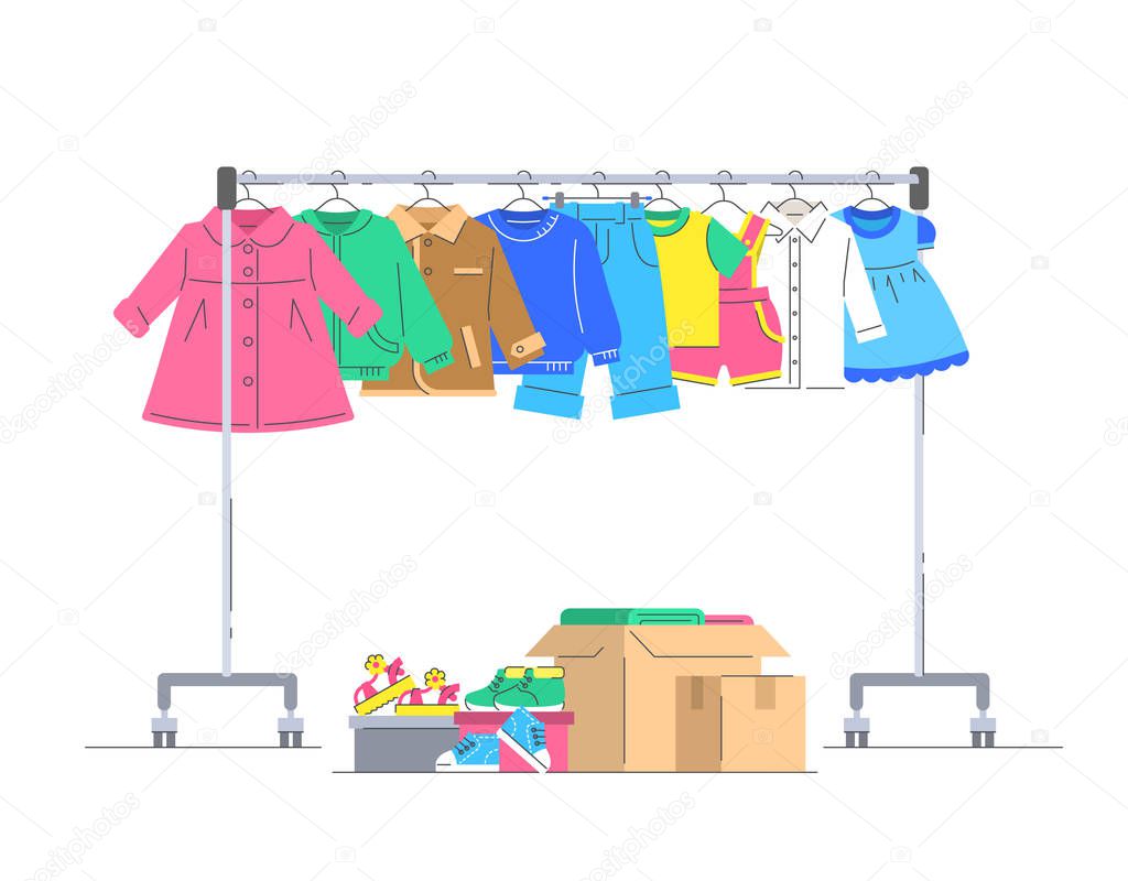 Kids clothes and shoes on hanger rack for donation