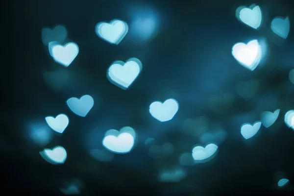 Blurred blue heart shape bokeh background