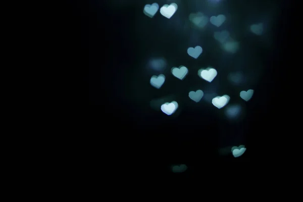 Bulanık mavi kalp şekli bokeh arkaplan