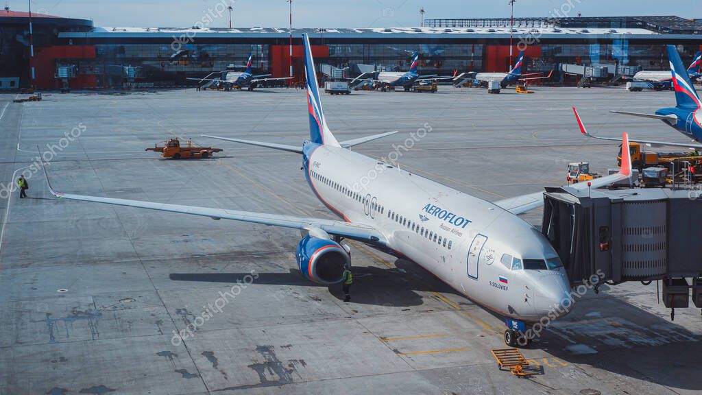 Moscow / Russia - March 16 2020: Boeing 737-800 Aeroflot at the gate of Sheremetyevo Airport, Terminal B. At the background ther planes of Aeroflot at the gates.
