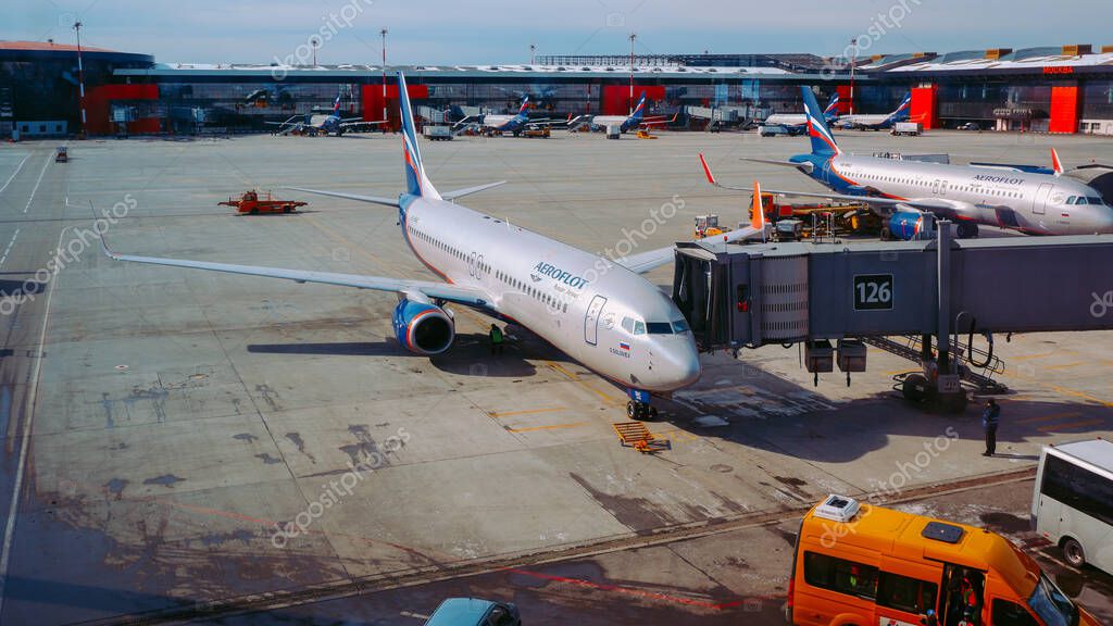 Moscow / Russia - March 16 2020: Boeing 737-800 Aeroflot at the gate of Sheremetyevo Airport, Terminal B. At the background ther planes of Aeroflot at the gates.