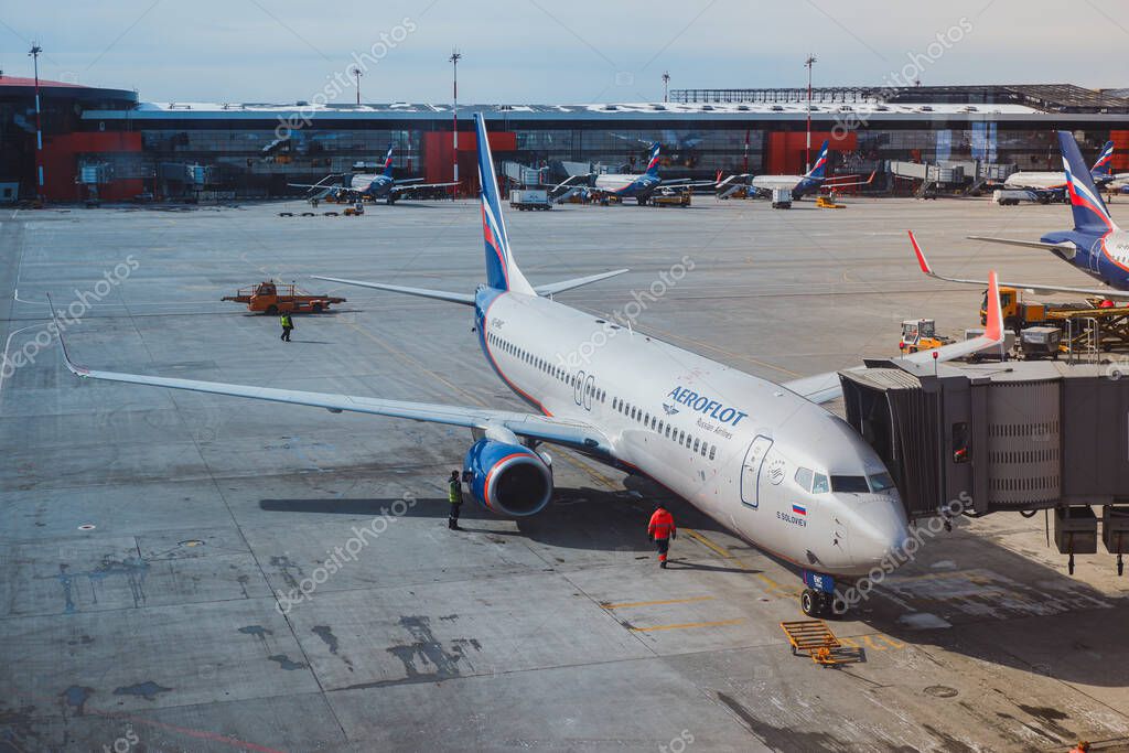 Moscow / Russia - March 16 2020: Boeing 737-800 Aeroflot at the gate of Sheremetyevo Airport, Terminal B. At the background ther planes of Aeroflot at the gates.